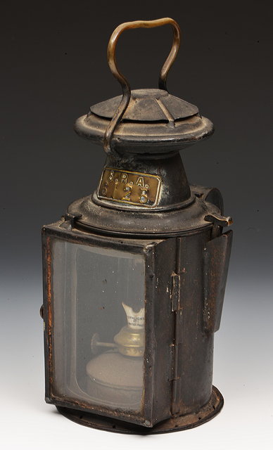 Appraisal: AN OLD BLACK PAINTED GUARDS LAMP with brass label 'S