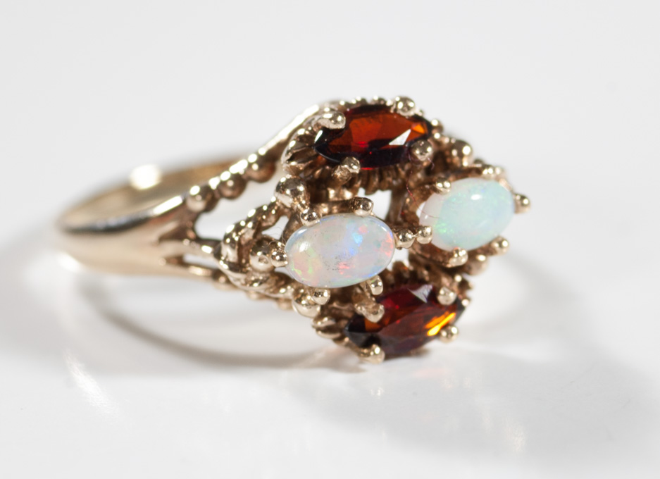 Appraisal: OPAL GARNET AND TEN KARAT GOLD RING set with two