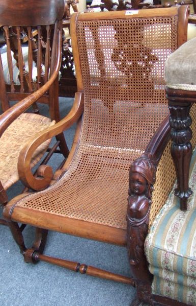 Appraisal: A th century mahogany framed open armchair with cane work