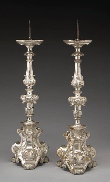 Appraisal: A pair of Italian Baroque silvered giltwood candlesticks th century