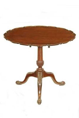 Appraisal: A carved mahogany tripod table in George III style the