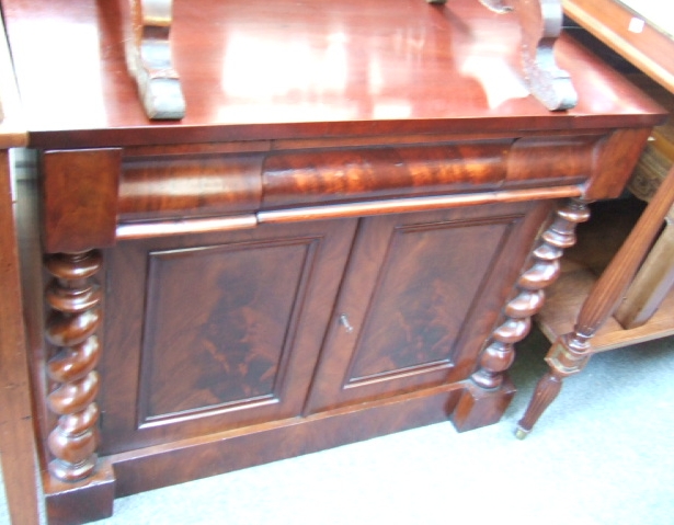 Appraisal: A Victorian mahogany chiffonier with a frieze drawer above two