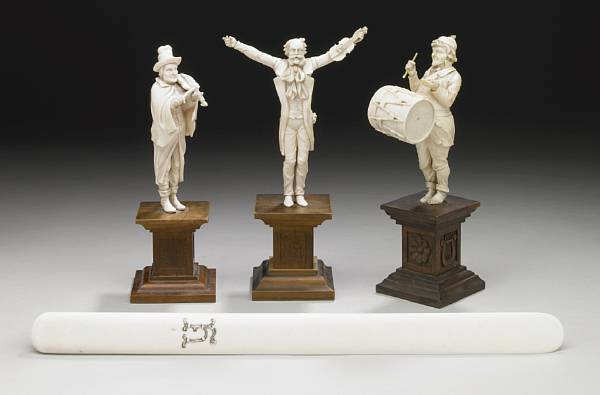 Appraisal: A group of three German carved ivory figures of musicians