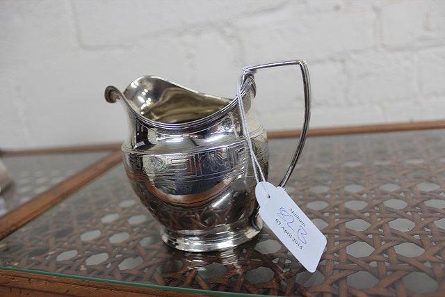 Appraisal: A GEORGIAN SILVER MILK JUG with acanthus leaf and Greek