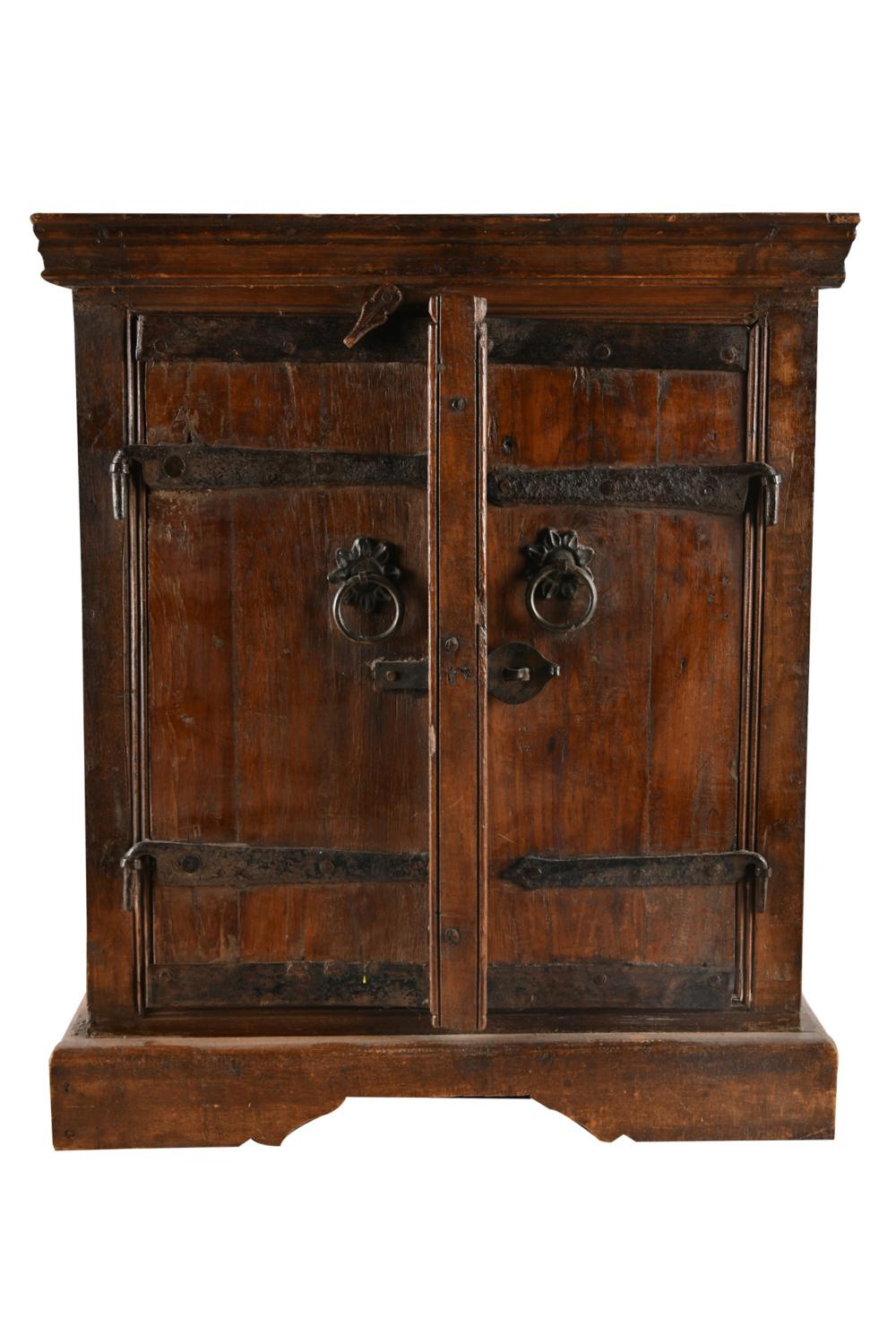 Appraisal: SMALL ASIAN-STYLE IRON-MOUNTED WOOD CABINEThaving a pair of hinged doors