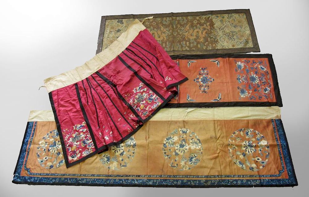 Appraisal: Group of Chinese Embroidered Fabrics A silk embroidered apron skirt