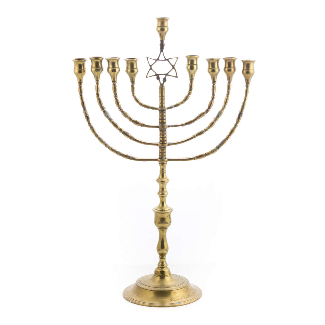 Appraisal: Cast brass menorah late th early th century center socket