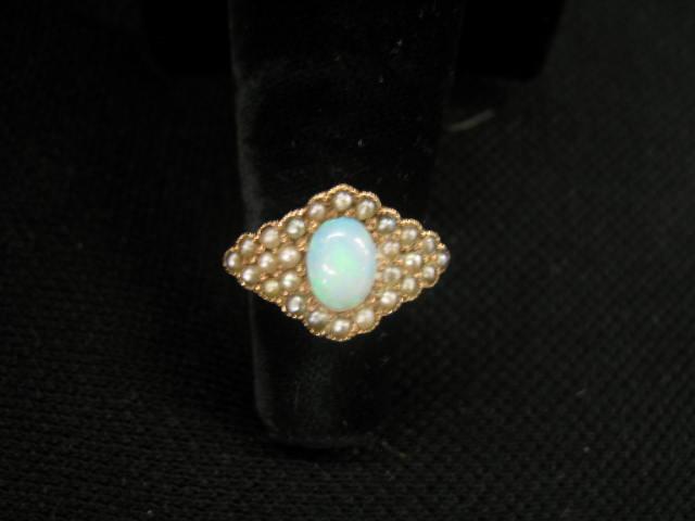 Appraisal: Opal Ring fiery blue green oval gem surrounded by seed