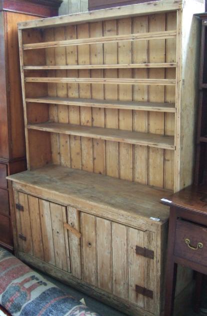 Appraisal: A th century pine dresser the enclosed three tier plated