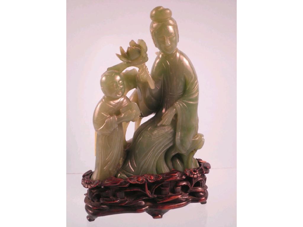 Appraisal: A Chinese green hardstone group of a lady and young