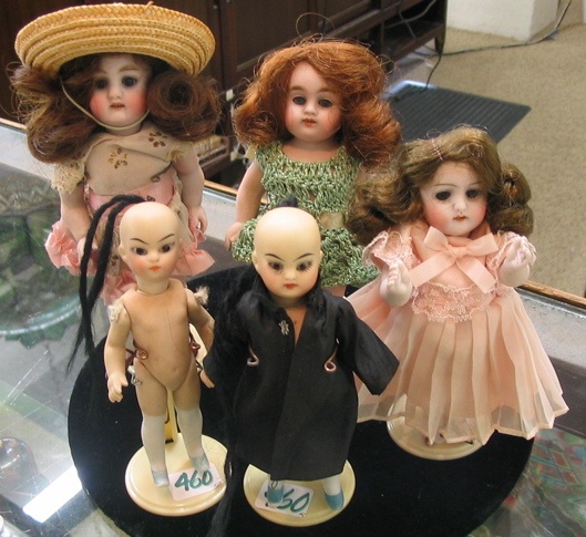 Appraisal: A GROUP OF FIVE ALL BISQUE DOLLS including German girl