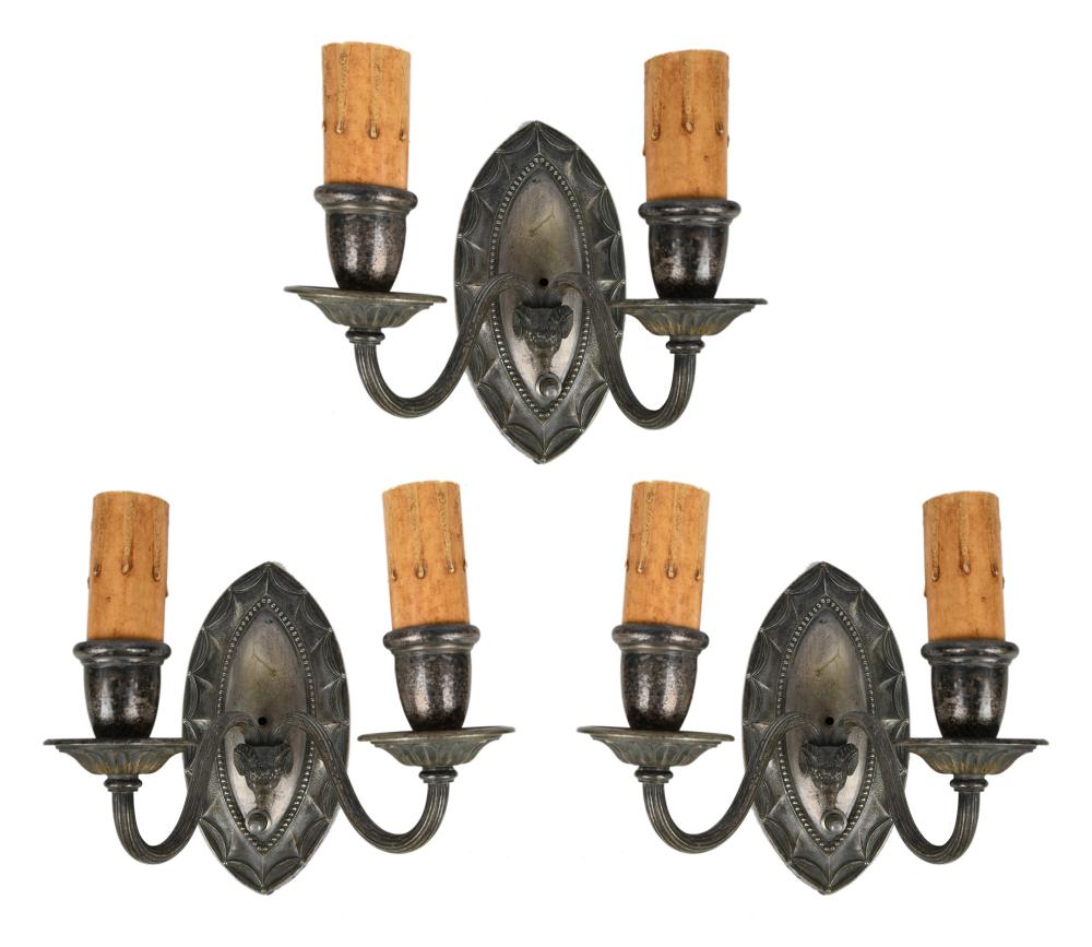 Appraisal: THREE SILVERED METAL RAMS HEAD SCONCESCondition with wear and discoloration