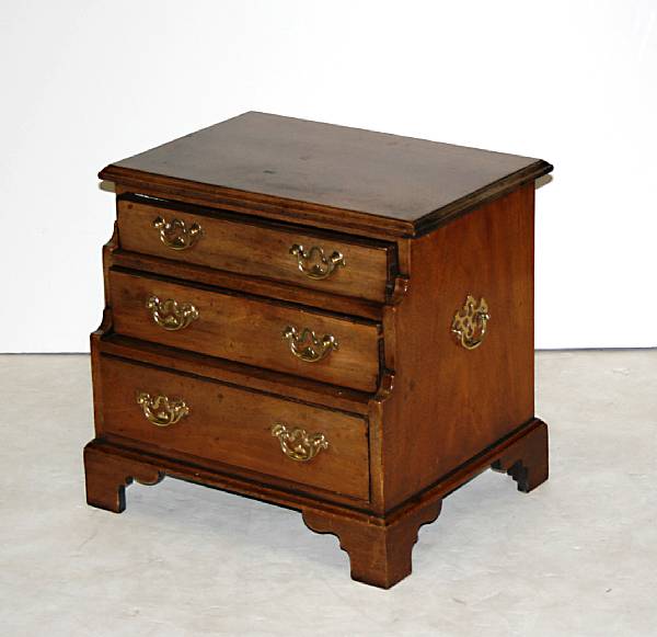 Appraisal: A George III style mahogany three drawer waterfall miniature chest