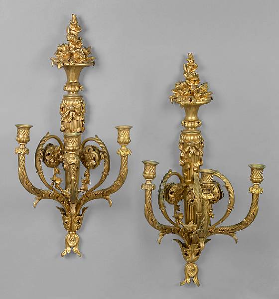 Appraisal: A pair of Louis XVI style gilt bronze three light