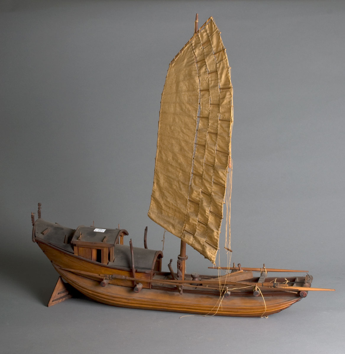 Appraisal: CARVED MODEL OF A CHINESE JUNK The carved wood hull