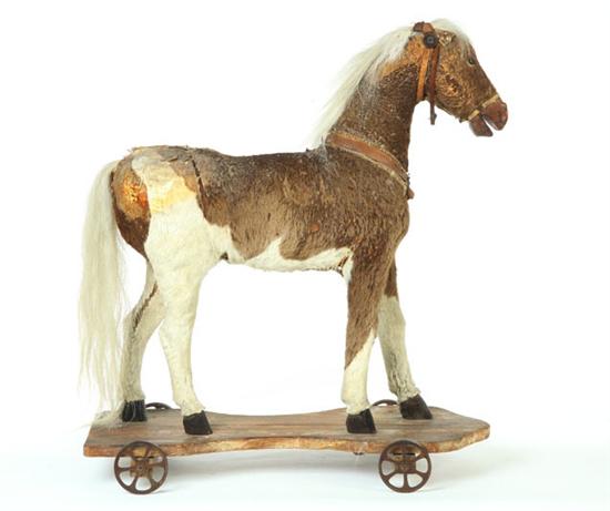 Appraisal: LARGE HORSE PULL TOY Probably Germany early th century Wood