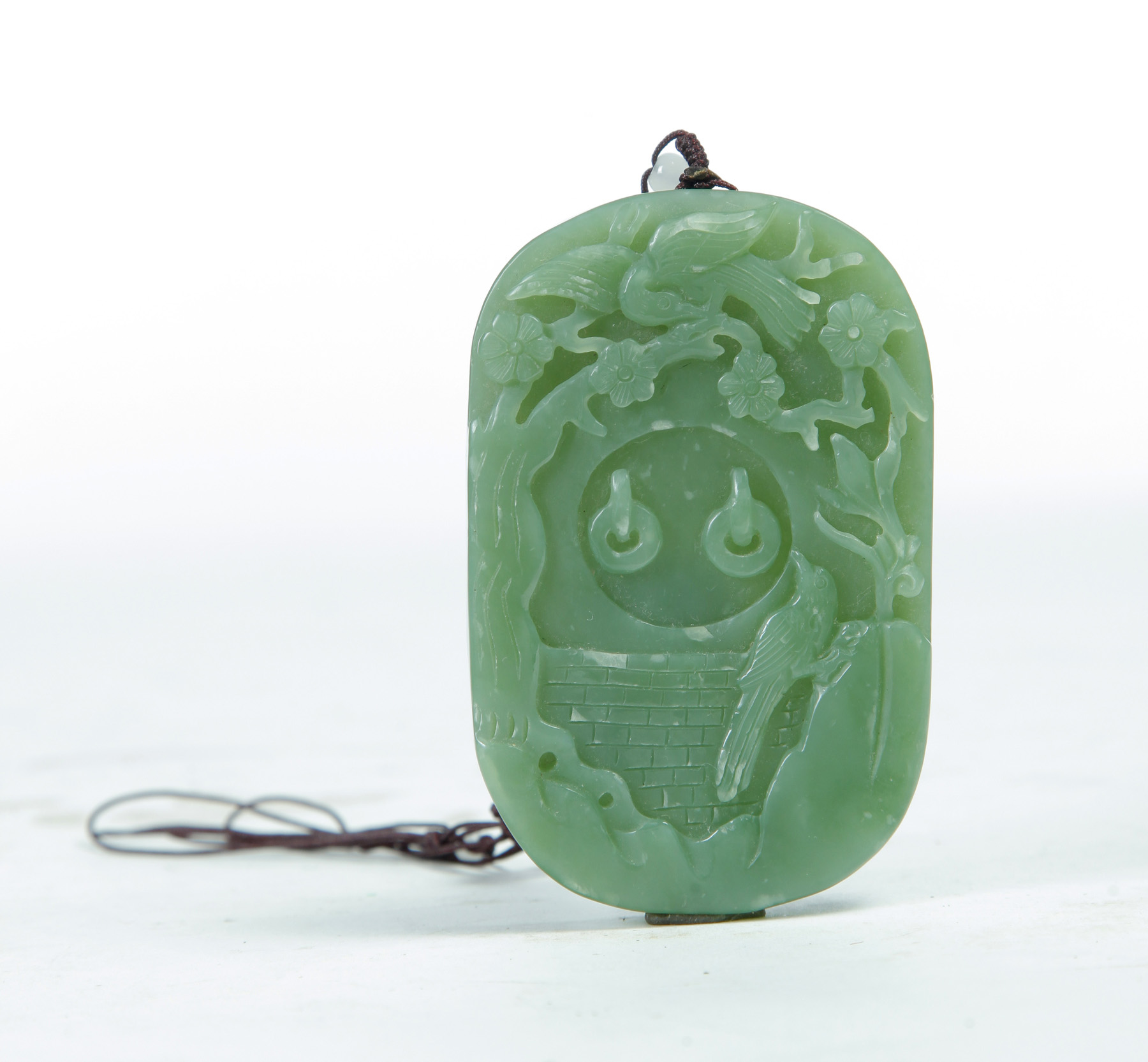 Appraisal: CHINESE JADEITE PENDANT WITH BIRDS Early th century Oval with