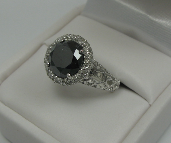 Appraisal: BLACK DIAMOND AND K WHITE GOLD RING WITH APPRAISAL centering