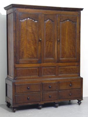 Appraisal: AN OAK PRESS CUPBOARD with moulded cornice the fascia with