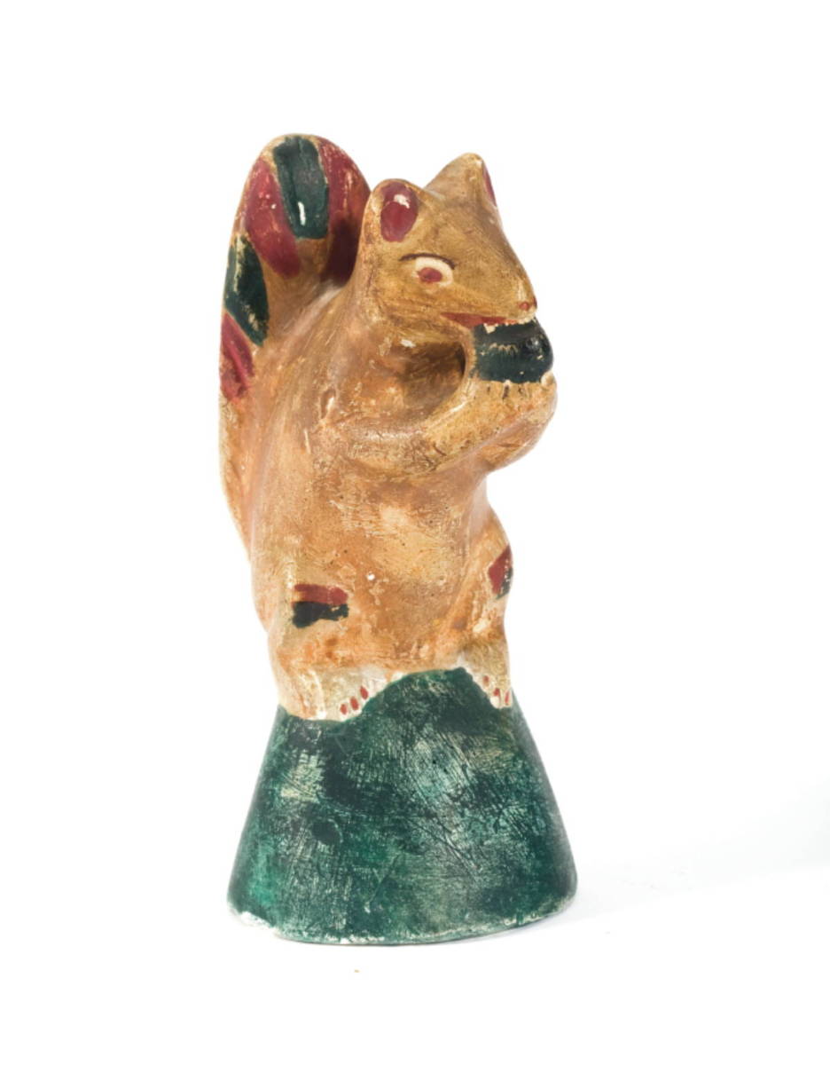 Appraisal: PAINTED MOLDED CHALKWARE FIGURE OF A SQUIRREL NINETEENTH CENTURY Modeled