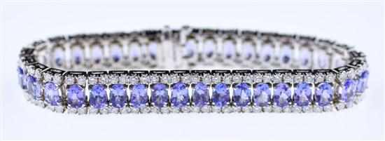 Appraisal: Tanzanite and diamond line bracelet thirty-seven oval tanzanites ctw and