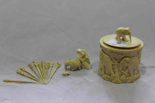 Appraisal: AN INDIAN IVORY CARVED CYLINDRICAL CONTAINER and cover carved with