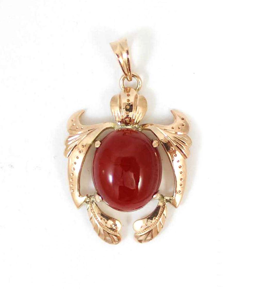 Appraisal: CORAL AND EIGHTEEN KARAT GOLD PENDANT with four gold prongs