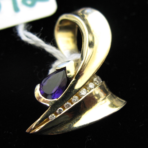 Appraisal: AMETHYST DIAMOND AND FOURTEEN KARAT GOLD PENDANT set with a