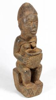 Appraisal: Lobi Lobi Burkina Faso stone female sculpture depicted traditionally seated