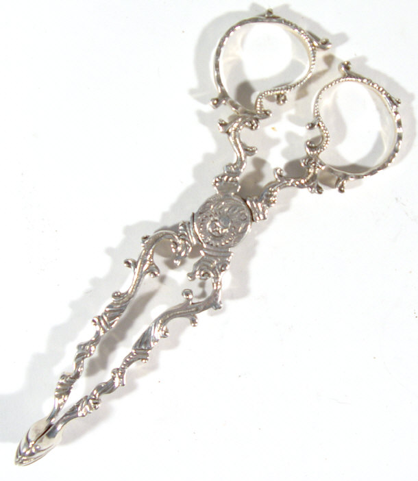 Appraisal: Pair of Victorian silver sugar nips chased with flowers Birmingham