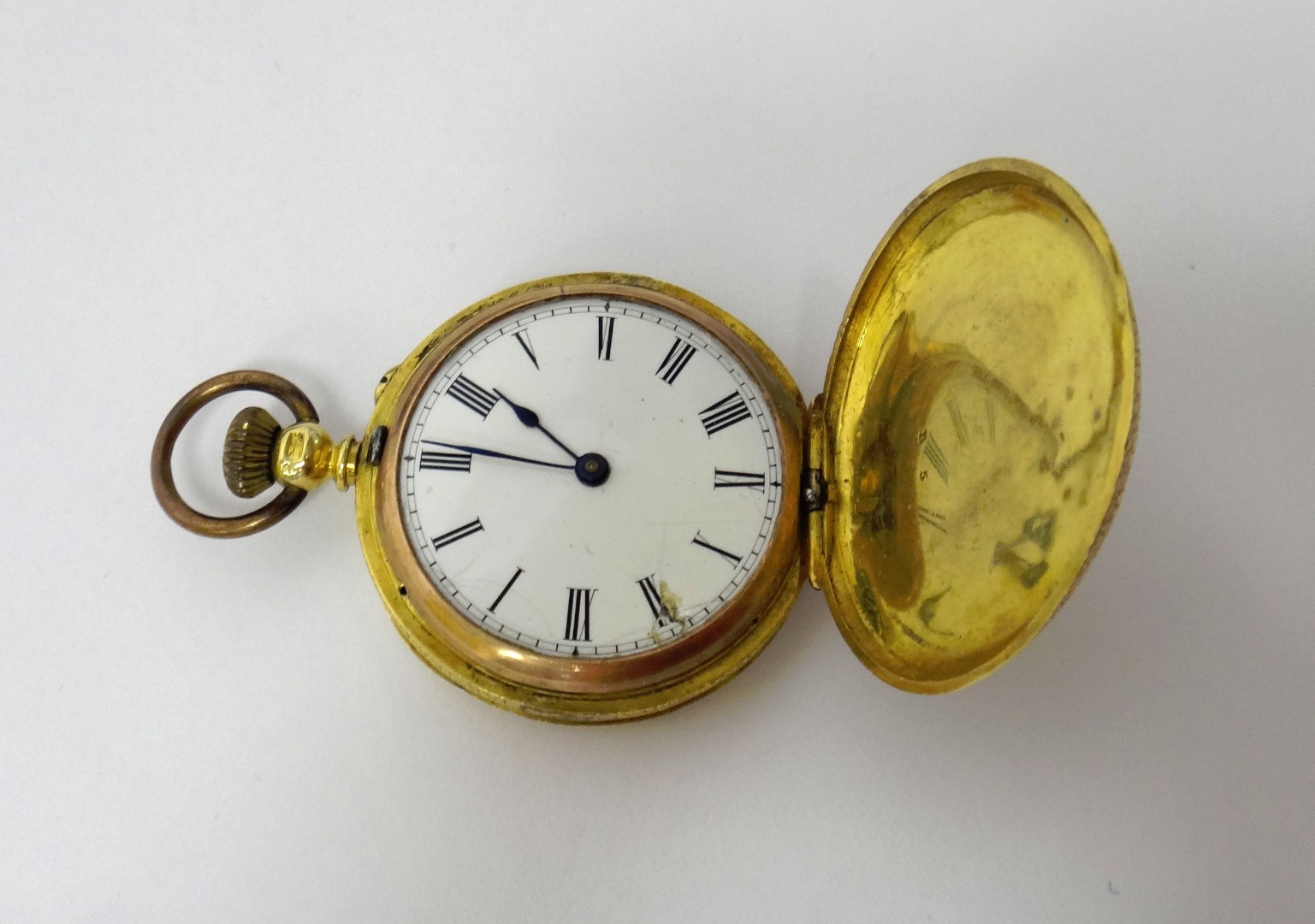 Appraisal: A lady's gold cased keyless wind hunting cased fob watch