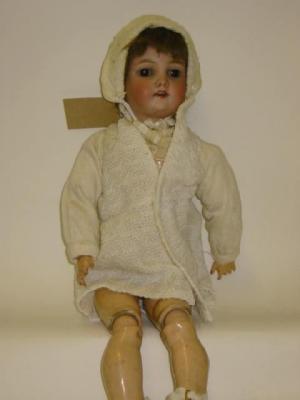 Appraisal: A Heinrich Handwerck bisque head girl doll with brown glass