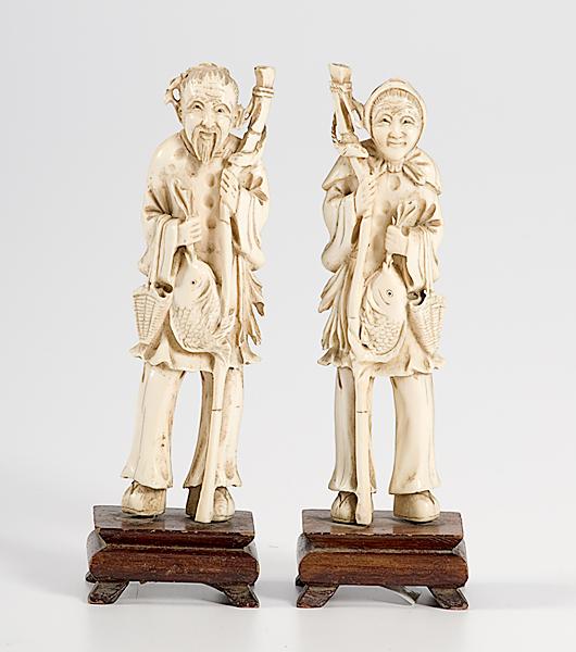 Appraisal: PAIR OF IVORY FISHERMAN FIGURES Late th early th century