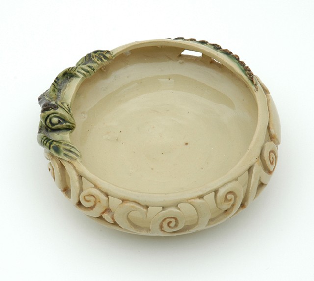 Appraisal: MARGUERITE MAHOOD - Victoria circa A shallow circular pierced earthenware