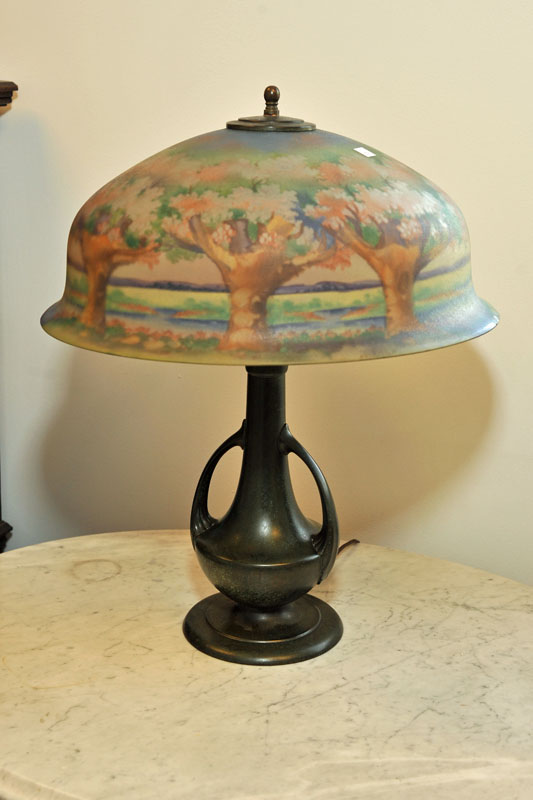 Appraisal: PAIRPOINT TABLE LAMP Reverse painted shade depicting a forest on