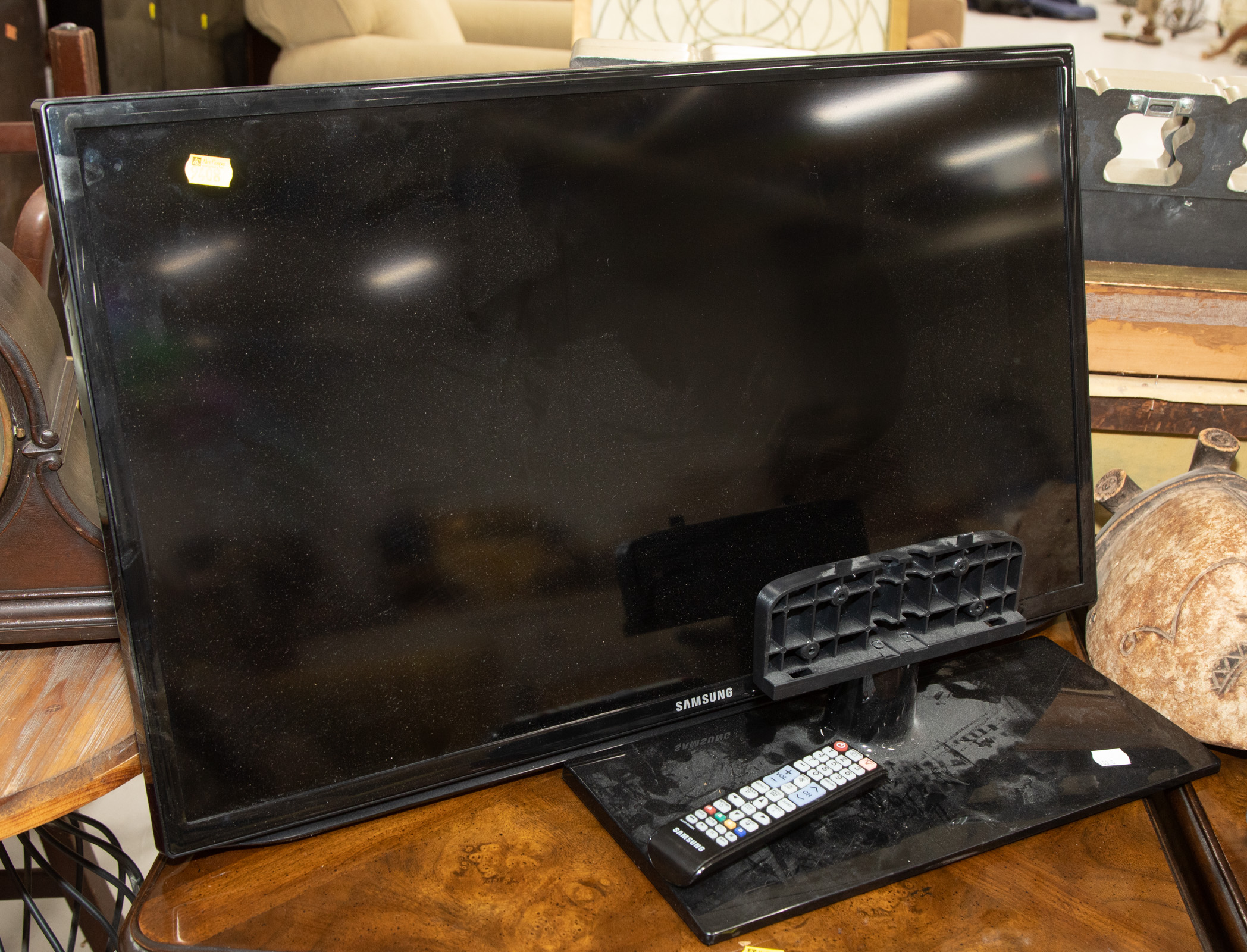 Appraisal: SMALL SAMSUNG FLAT SCREEN TELEVISION With stand and remote