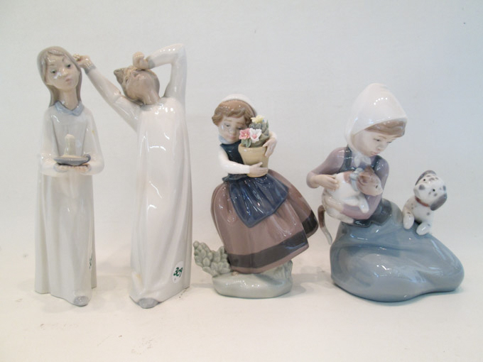 Appraisal: FOUR LLADRO PORCELAIN FIGURINES Girl With Puppy and Kitten Yawning