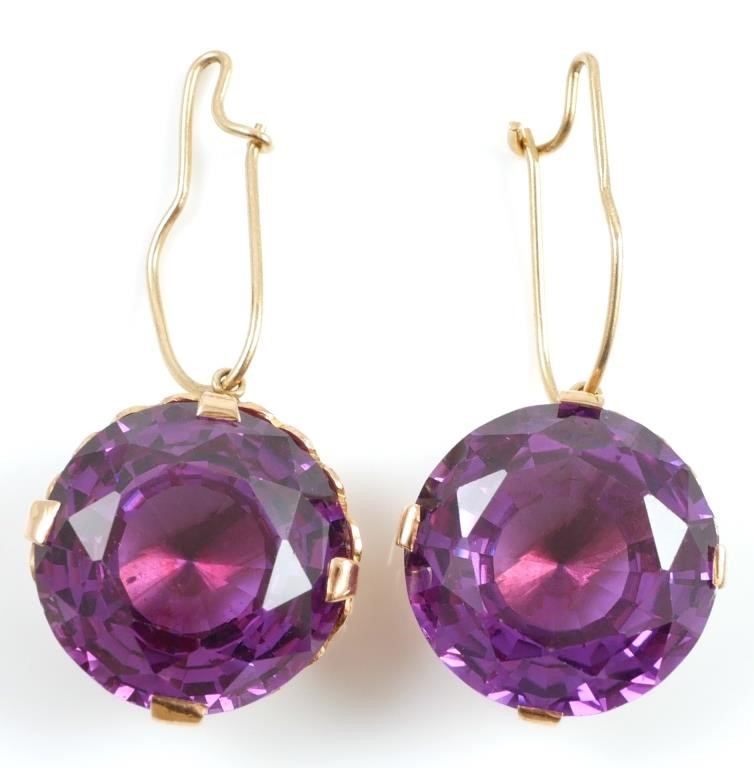 Appraisal: K yellow gold earrings contain round faceted synthetic color change