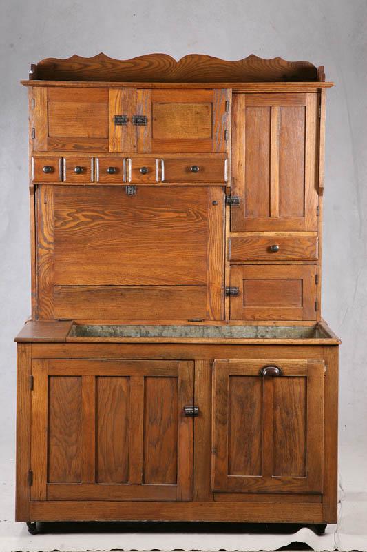 Appraisal: TWO PIECE KITCHEN CUPBOARD Oak with a drysink bottom a