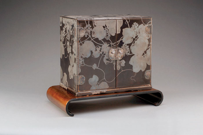 Appraisal: JAPANESE BLACK AND SILVER LACQUERED STORAGE BOX WITH SILVER MOUNTS