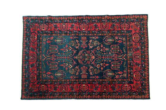 Appraisal: ORIENTAL RUG Kirman Multiple borders and bold colors of red