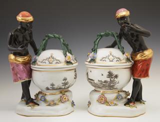 Appraisal: Pair of German Porcelain Meissen Style Blackamoor Covered Sweetmeat Bowls