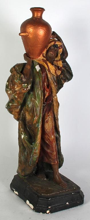 Appraisal: PAINTED PLASTER FIGURE OF A MIDDLE EASTERN FEMALE WATER CARRIER