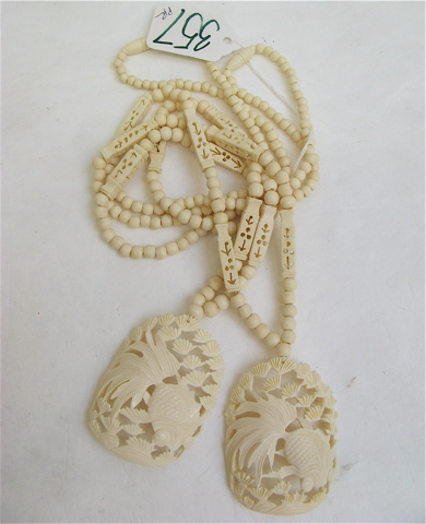 Appraisal: PAIR OF CHINESE CARVED BONE NECKLACES having attached carved bone