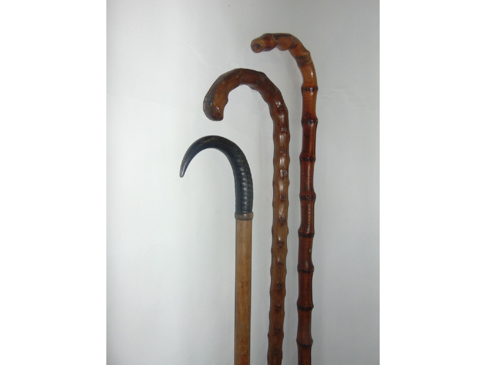 Appraisal: An antique timber walking cane terminating in an applied horn