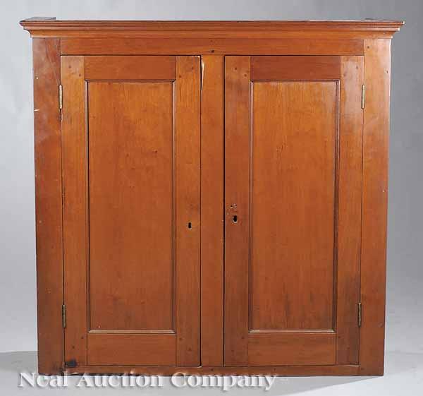 Appraisal: An American Mahogany Cabinet mid- th c the molded top