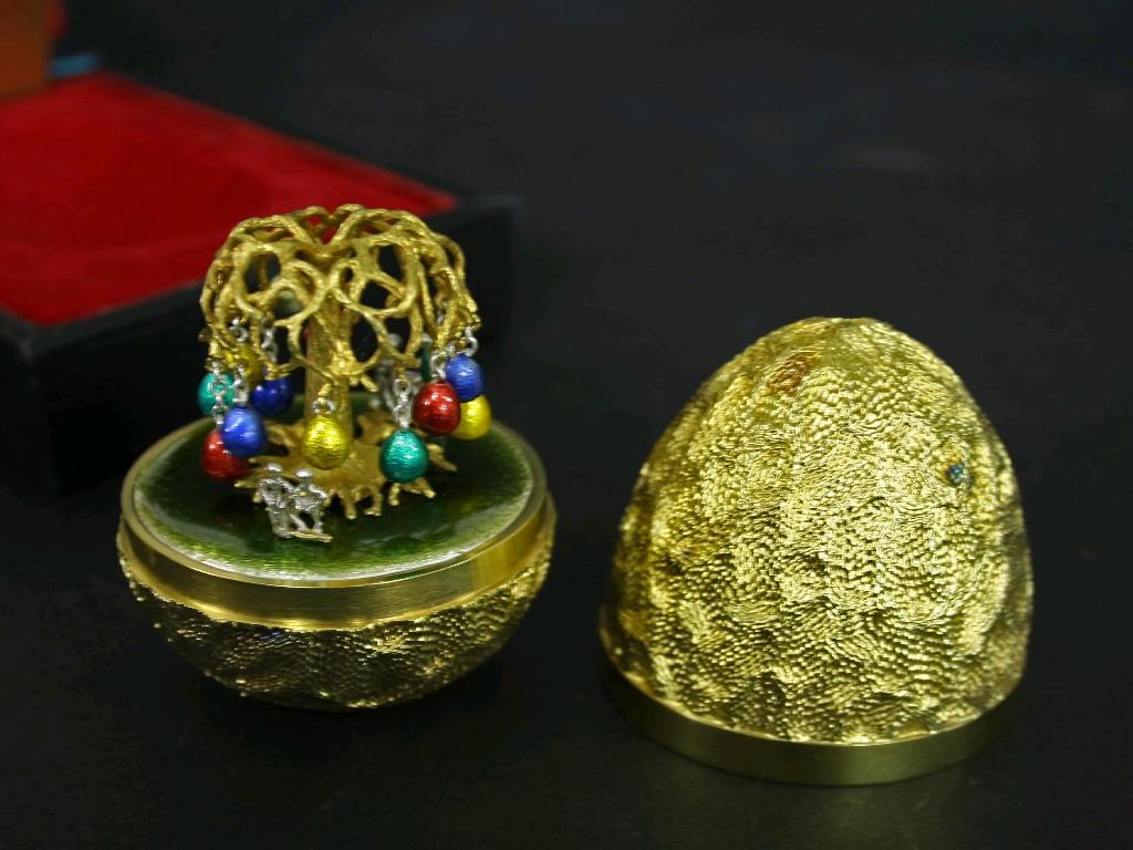 Appraisal: Stuart Devlin silver-gilt Easter egg the planished egg enclosing an