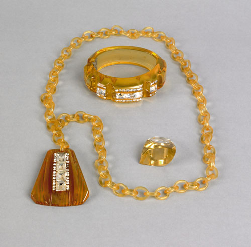 Appraisal: Lucite and bakelite amber colored matching necklace hinged bracelet and