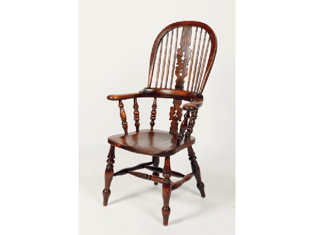 Appraisal: AN ELM AND FRUITWOOD HIGH BACKED WINDSOR ARMCHAIR with a