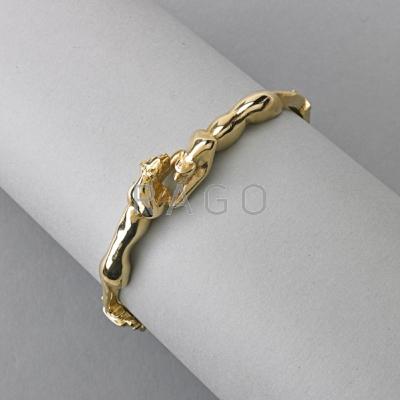 Appraisal: K YELLOW GOLD JAGUAR HINGED BRACELET ca Confronted jaguars dwt